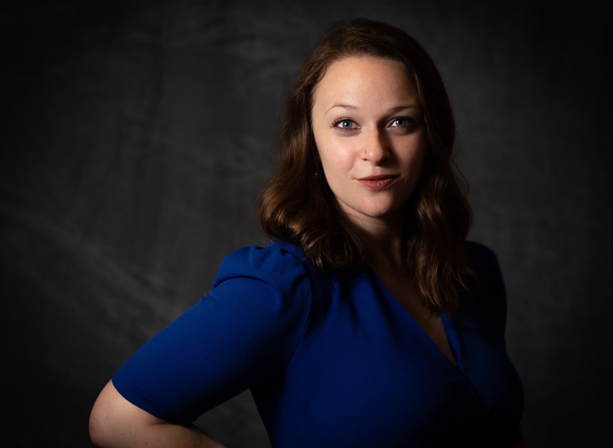 Portrait of Brynn Jacobs in a royal blue dress